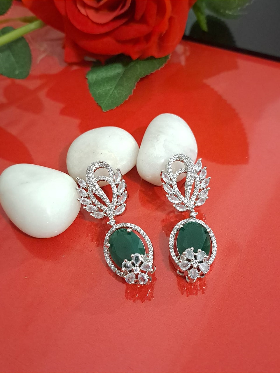 Big Oval green Earrings studded with American Diamond stones and Rhodium White